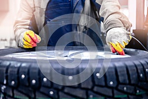 Filling car wheel with air, replacing summer tires, removing puncture