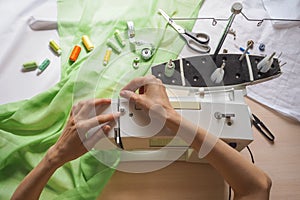 Filling the coil threads on the sewing machine. Stages of the production cycle on a sewing machine.