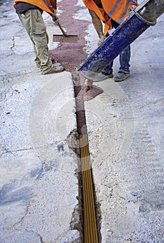 Filling with colored concrete of excavation