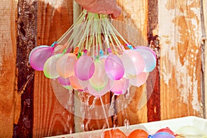 Filling colorful water balloons