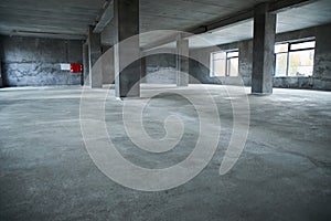 Filling the floor with concrete, screed and leveling the floor. Smooth floors made of a mixture of cement, industrial concreting photo