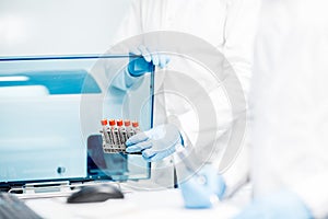 Filling test tubes into the analyzer machine