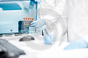 Filling test tubes into the analyzer machine