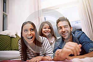 Filling their home with love and laughter. Portrait of a happy family spending quality time together at home.