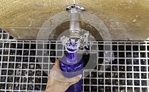 Filling water bottle