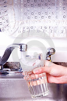 Filling water glass at faucet