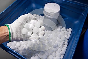 filling water softener with salt tablets photo