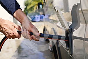 Filling the water tank of a campervan