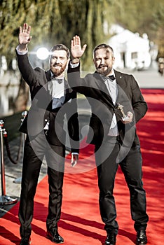 Film actors on the red carpet outdoors