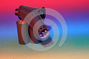 Film of an analogue camera with colorful background photographed in the studio