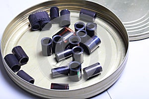 Film archive negatives in a round metal can