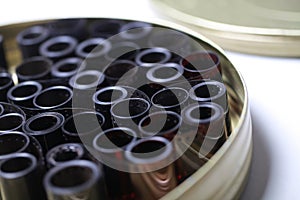 Film archive negatives in a round metal can