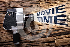 Film Camera Emitting Light With Text Movie Time