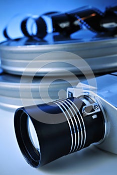 Film camera and movie film reel canisters