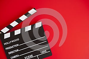 Film clapper on red background