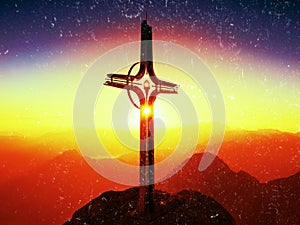 Film effect. Lens flare light, strong effect. Cross on peak of Hoher Goell. Iron crucifix at mountain top in Alp at Austria Germa
