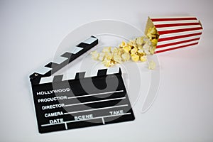 Film flap with popcorn on a white background