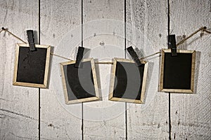 Film Looking Chalkboards Hanging on a Rope Held By Clothespins