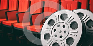 Film movie reels with blurry red theater seats background, copy space, 3d illustration.