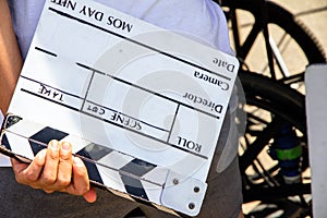 Film production crew holding Film Slate on set