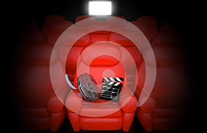 Film reel with clapboard in cinema