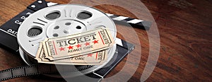 Film reel with retro cinema tickets on top, on a movie clapper, wooden background, copy space, banner, 3d illustration.