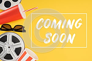 Film reels, 3d glasses, popcorn bucket, red disposable cup with straw and coming soon lettering isolated