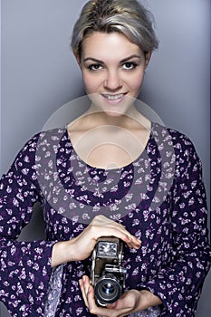 Film Student Holding a Vintage Camera