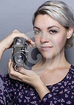 Film Student Holding a Vintage Camera