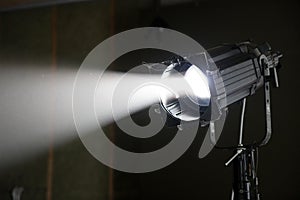 Film Studio Spotlight Projecting Beam of Light Through Smoke Haze