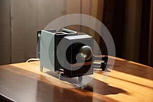 Film-viewing device slide projector lay on the table