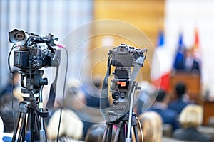 Filming media event with a video or television camera photo