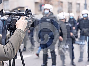 Filming riot police during crowd protest against COVID-19 pandemic restrictions