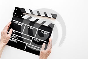 Filmmaker accessories. Clapperboard on white background top view copyspace