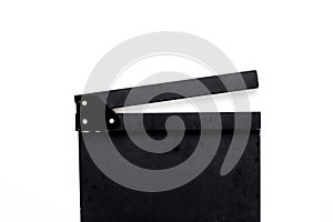Filmmaker profession. Clapperboard on white background top view copyspace