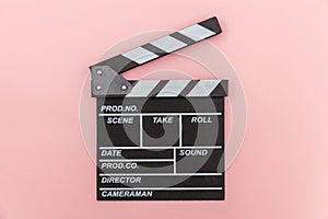 Filmmaker profession. Classic director empty film making clapperboard or movie slate isolated on pink background. Video production
