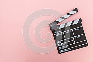 Filmmaker profession. Classic director empty film making clapperboard or movie slate isolated on pink background. Video production