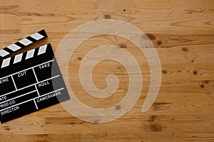 Filmmaking concept. Movie Clapperboard. Cinema begins with movie clappers. Movie clapper board on old wooden background