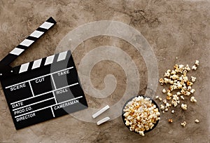 Filmmaking concept. Movie Clapperboard. Cinema begins with movie clappers. Movie clapper board on a textural background and