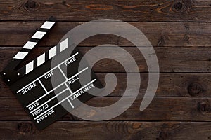 Filmmaking concept. Movie Clapperboard. Cinema begins with movie clappers. Movie clapper board on a wooden background