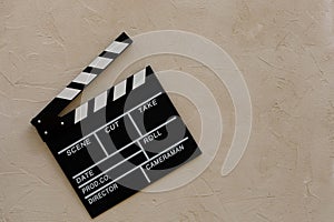 Filmmaking concept. Movie Clapperboard. Cinema begins with movie clappers. Movie clapper on a light texture background and popcorn