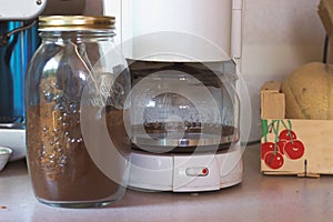 Filter coffee appliance and coffee in a jar, ready to make