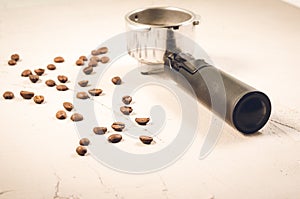 Filter holder and roasted beans coffee/Filter holder and roasted beans coffee on a concrete background