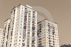 Filtered image lookup typical condos with hanging clothes over blue sky in Hanoi, Vietnam
