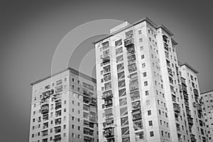 Filtered image lookup typical condos with hanging clothes over blue sky in Hanoi, Vietnam