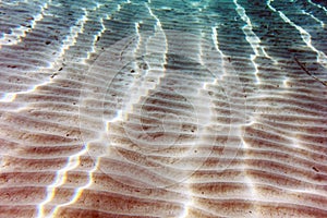 Filtered Sunlight Streaks on Sandy Sea Bottom