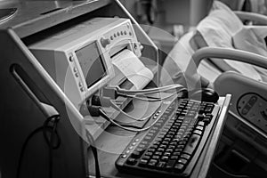 Filtered tone close-up fetal monitor with baby heart beats at labor room hospital