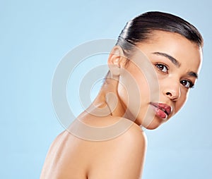 Filters are great but great skin is better. Studio portrait of an attractive young woman posing against a blue