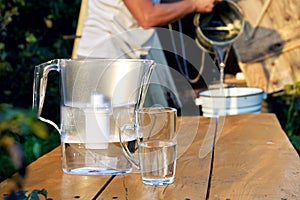 Filtration of a well water using a water filter at countryside