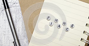 FINACE concept. pen, notebooks and white background